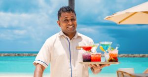 Cocktails on the beach at Veligandu Maldives