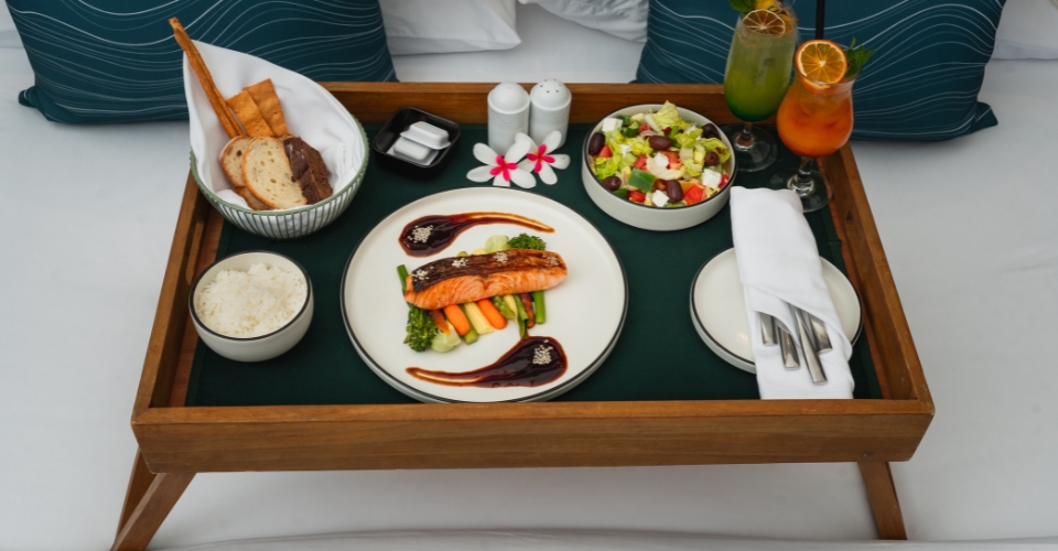 Dining in bed at Veligandu Maldives