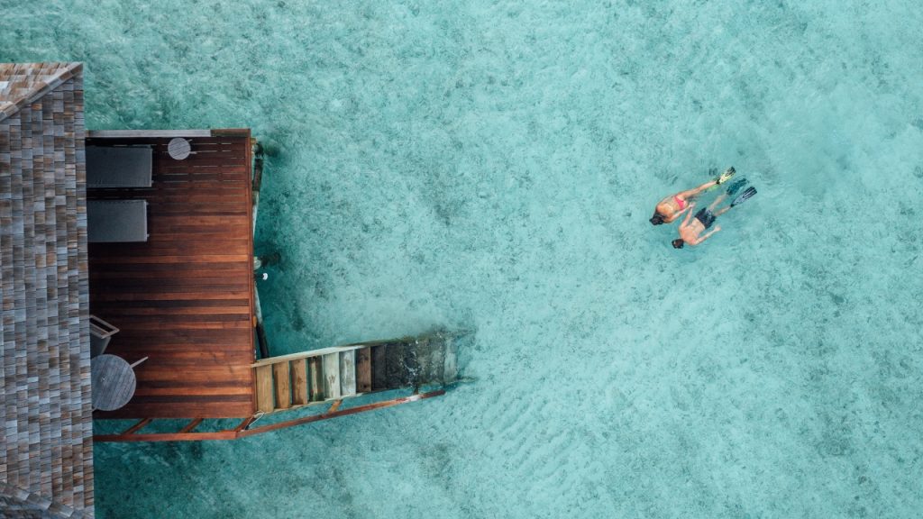 Explore the house reef from your villa at Veligandu Maldives
